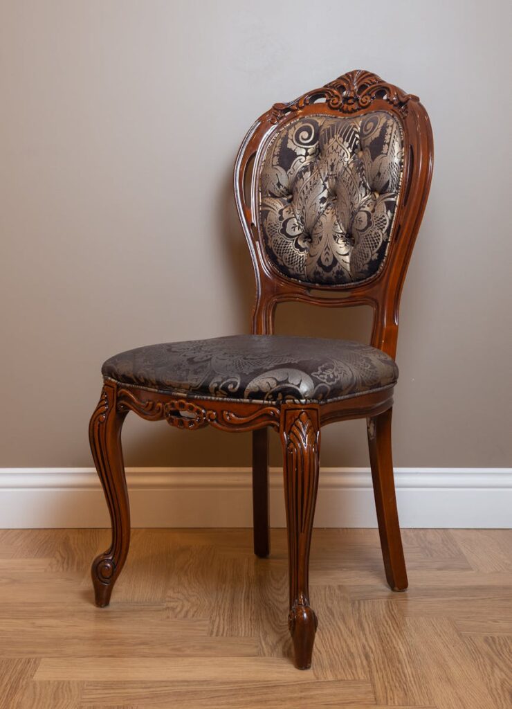 Antique Ornate Chair Standing in Room